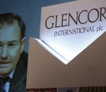 Glencore CEO Ivan Glasenberg is broadcast on a screen during a tele-conference in Hong Kong