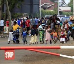 Displaced people cross the border from the Democratic Republic of Congo into Rwanda, as seen from Gisenyi